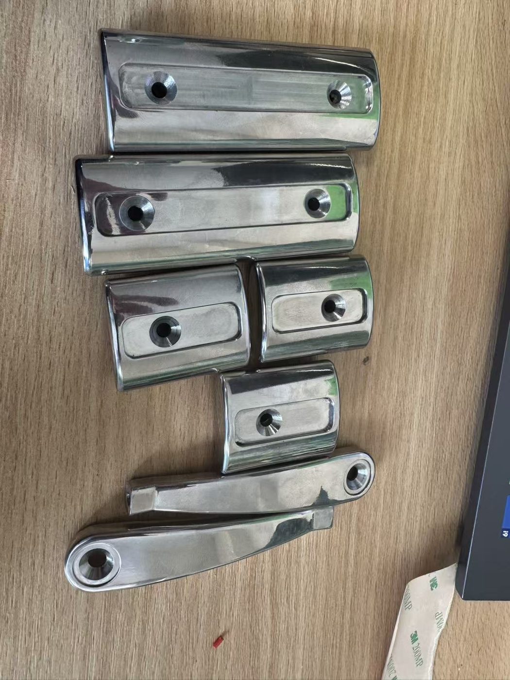 Mirror-polished stainless steel handles and lever components